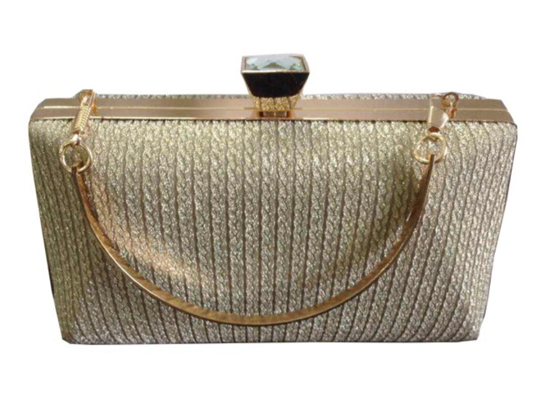 Gold clutch bag with a textured surface on a white background