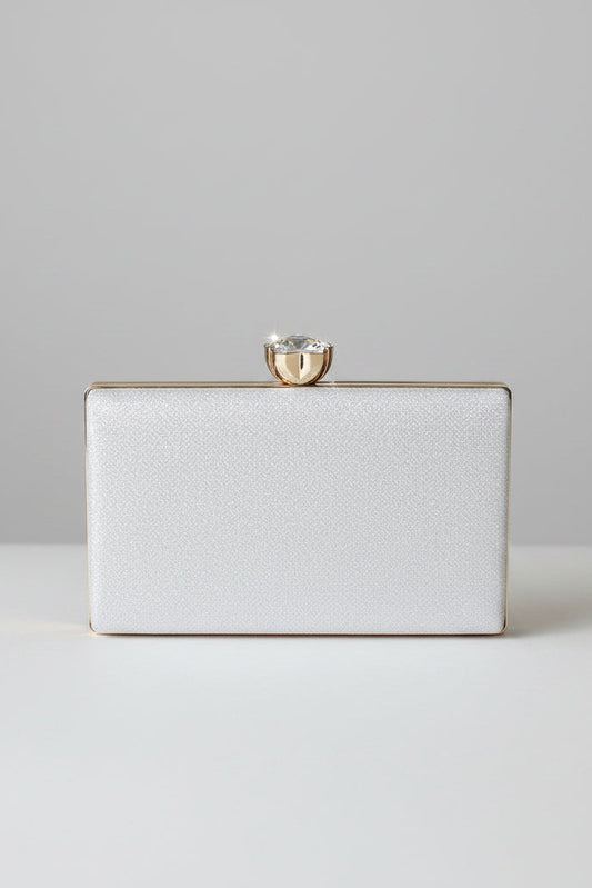 White textured clutch bag with a gold clasp on a white background