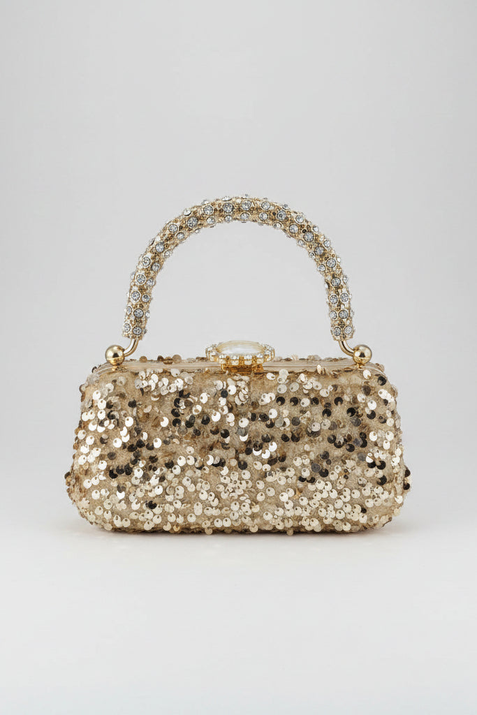 Sparkly handbag with rhinestone handle on a white background