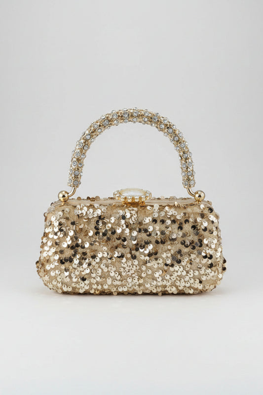 Sparkly handbag with rhinestone handle on a white background