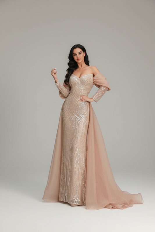 Woman in a sparkling evening gown standing on stone steps with decorative balustrades.