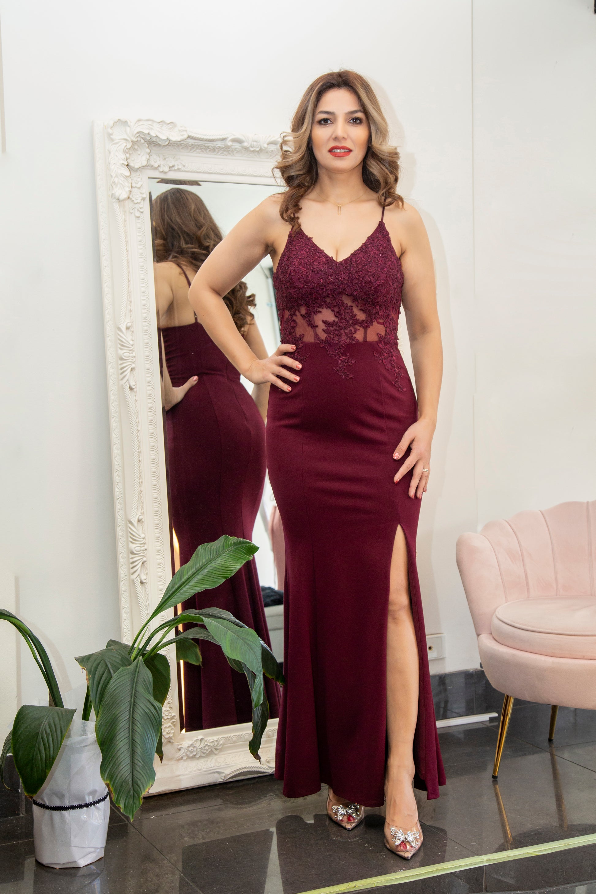 Woman in a burgundy evening gown.