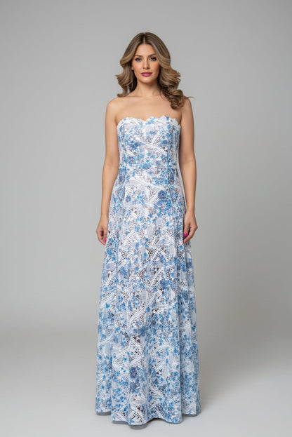 Woman wearing a strapless floral dress on a gray background