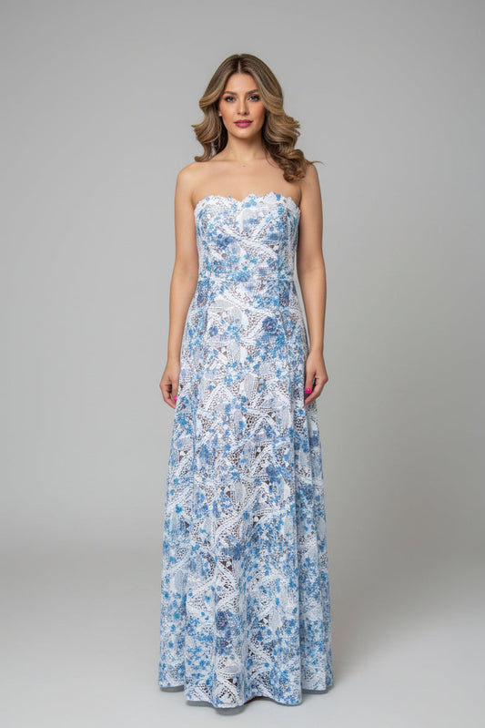 Woman wearing a strapless floral dress on a gray background