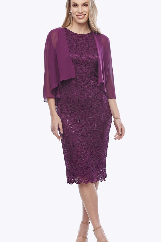 Woman wearing a purple lace dress with a matching jacket on a white background