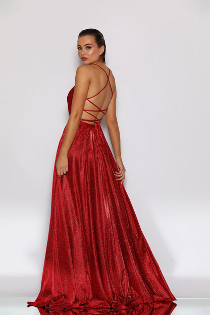 Woman wearing a red evening gown with a white background