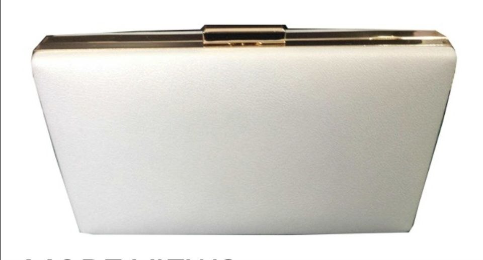 White clutch bag with gold accents on a white background