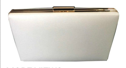 White clutch bag with gold accents on a white background