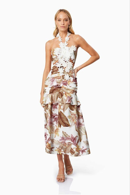 Woman wearing a floral dress on a white background