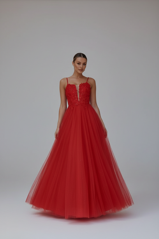 Woman wearing a red evening gown with a white background