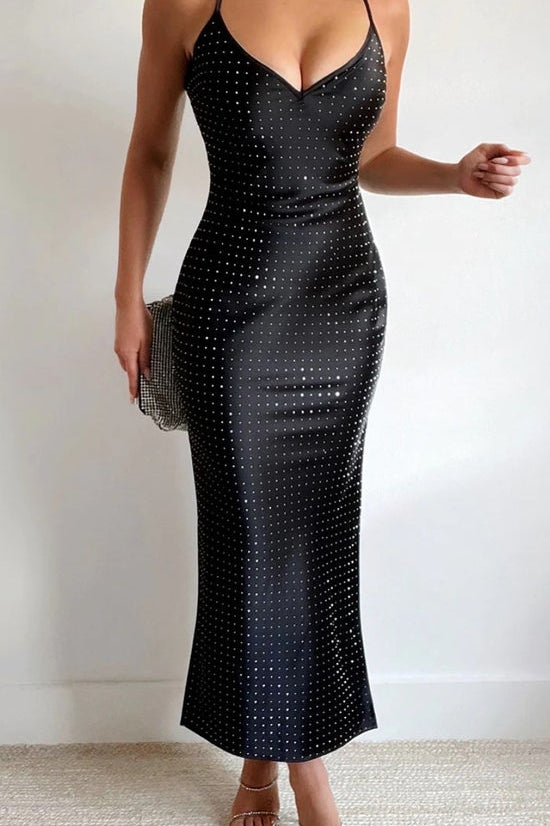Black sequin dress worn by a person on a plain background